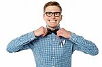 Nerd Guy Adjusting His Bow Tie Stock Photo