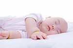 Newborn Baby Girl Sleeping In Bed Stock Photo