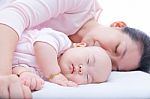 Newborn Baby Girl Sleeping In Mother Arm Stock Photo