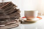Newspapers And Coffee Stock Photo