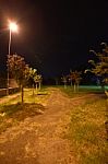 Night Public Park In The City With Houses Near Stock Photo