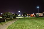 Night Public Park In The City With Houses Near Stock Photo