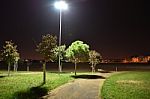 Night Public Park In The City With Houses Near Stock Photo