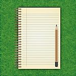 Notebook With White Page On Green Grass Background Stock Photo