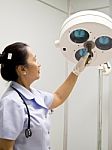 Nurse With Surgical Lamp Stock Photo