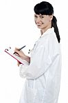 Nurse Writing Fresh Prescription For The Patient Stock Photo