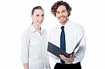 Office Colleagues Reviewing Business File Stock Photo