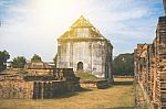 Old Ancient Pagoda In Lopburi Thailand, With Old Exterior Brick Wall Background Vintage Style Grung Texture Stock Photo