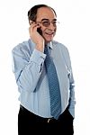 old Business Man Talking over phone Stock Photo