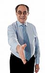 Old Businessman Offering Handshake Stock Photo