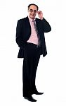 Old Businessperson Posing In Style Stock Photo