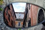 Old Italian Architecture Reflected In A Motorcycle Mirror Stock Photo