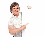 Old Lady Pointing At Blank Board Stock Photo