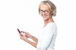 Old Lady Using Tablet Pc Device Stock Photo
