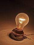 Old Light Bulb On Wall Stock Photo