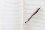 Open A Blank White Notebook And Pen Stock Photo