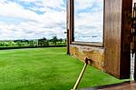 Opened Wooden Windows For Green Field And Sky Stock Photo