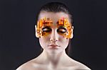 Orange And Red Rhinestones On A Girl Face Stock Photo