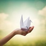 Origami Bird On Children's Hand Stock Photo