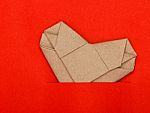 Origami Recycle Paper Heart On Red Paper Stock Photo