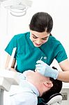 Orthodontist Examining Patient Stock Photo