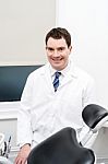 Orthodontist Posing In Lab Coat Stock Photo