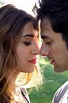 Outdoor Portrait Of Young Caucasian Couple At The Park Stock Photo