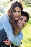 Outdoor Portrait Of Young Caucasian Couple At The Park Stock Photo