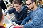 Outdoor Portrait Of Young Entrepreneurs Working At Coffee Bar Stock Photo