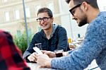 Outdoor Portrait Of Young Entrepreneurs Working At Coffee Bar Stock Photo