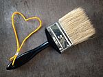 Paint Brush With A Yellow Rope Stock Photo