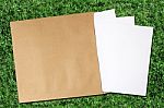 Paper And Envelope On Grass Stock Photo