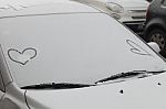 Parked Car Covered With The First Snow In Winter Stock Photo