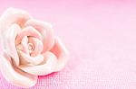 Pastel Rose (ceramic ) On Pink Fabic Background Stock Photo