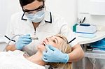 Patient Getting Treatment From Dentist Stock Photo