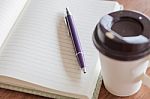 Pen And Notebook With Coffee Cup Stock Photo