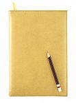 Pencil On Yellow Leather Notebook Stock Photo