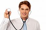 Physician Posing Withstethoscope Stock Photo