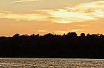 Picture With An Amazing Sunset On A Lake Stock Photo