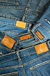 Pile Of Blue Jeans With Label Stock Photo