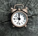 Pink Alarm Clock On Old Wooden Texture Stock Photo