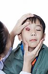 Pinkeye (conjunctivitis) Infection On A Boy, Doctor Check Up Eye Patient. Studio Shot Stock Photo