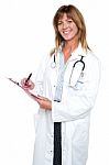 Pleasing Doctor Collecting Patient's Health History Stock Photo