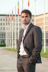 Politician In Front Of Parliament Stock Photo