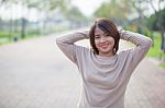 Portrait Asian Woman In A Park Stock Photo