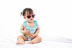 Portrait Baby Girl In Swimsuit On White Background Stock Photo