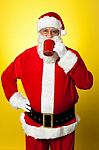 Portrait Of A Aged Santa Sipping Coffee Stock Photo