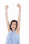 Portrait Of A An Excited Young Woman Celebrating Success Over Wh Stock Photo