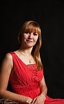 Portrait Of A Beautiful Woman In A Red Dress Stock Photo