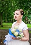 Portrait Of A Bride With A Bouquet Of Flowers Stock Photo